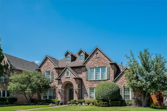 view of front of home with a front yard