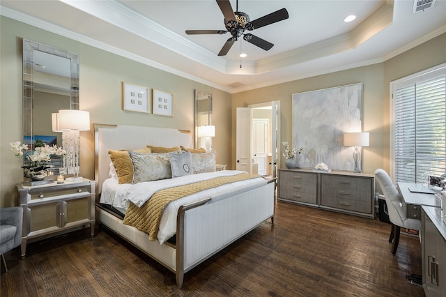 bedroom featuring dark hardwood / wood-style flooring, crown molding, a raised ceiling, and ceiling fan