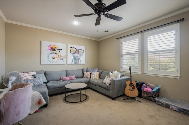 carpeted living room with crown molding and ceiling fan