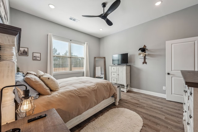 bedroom featuring hardwood / wood-style floors and ceiling fan