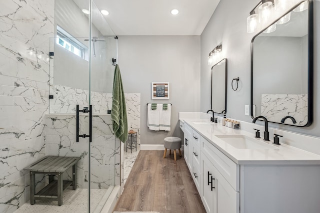 bathroom featuring vanity, wood-type flooring, and an enclosed shower