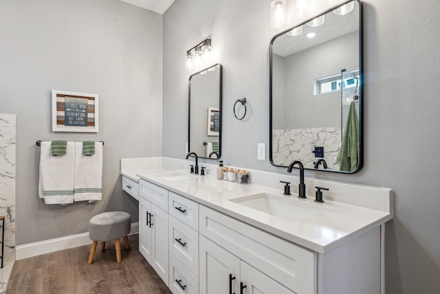 bathroom with vanity and hardwood / wood-style floors