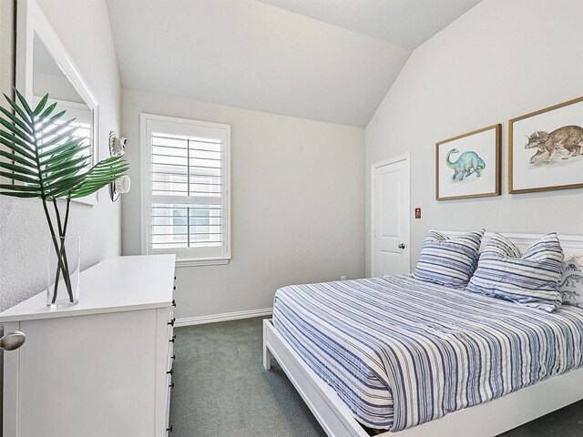 carpeted bedroom featuring vaulted ceiling