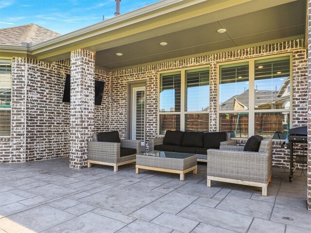 rear view of house with an outdoor living space, a yard, and a patio area