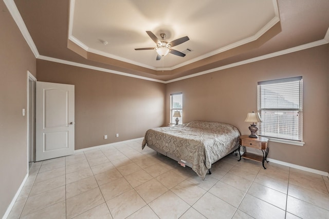 tiled bedroom with crown molding, ceiling fan, and a raised ceiling