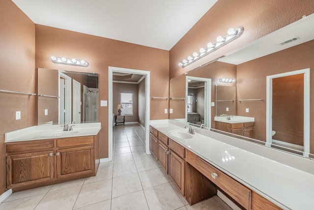 bathroom featuring tile patterned flooring and vanity