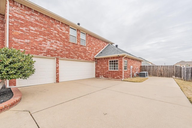 view of side of home featuring central AC