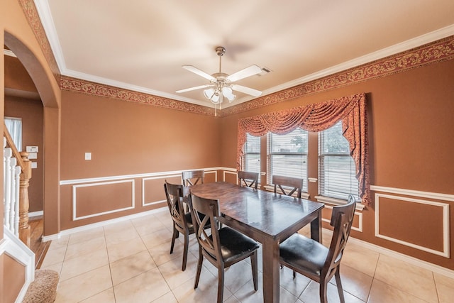 dining space featuring ornamental molding, ceiling fan, and light tile patterned flooring