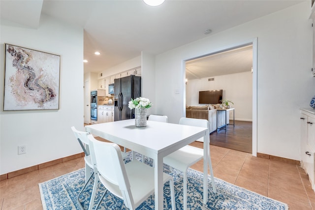 dining room with light tile patterned flooring