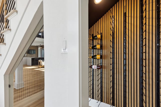 wine room with hardwood / wood-style floors