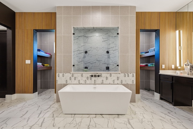 bathroom with vanity and independent shower and bath