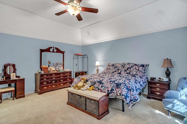 carpeted bedroom with crown molding, vaulted ceiling, and ceiling fan