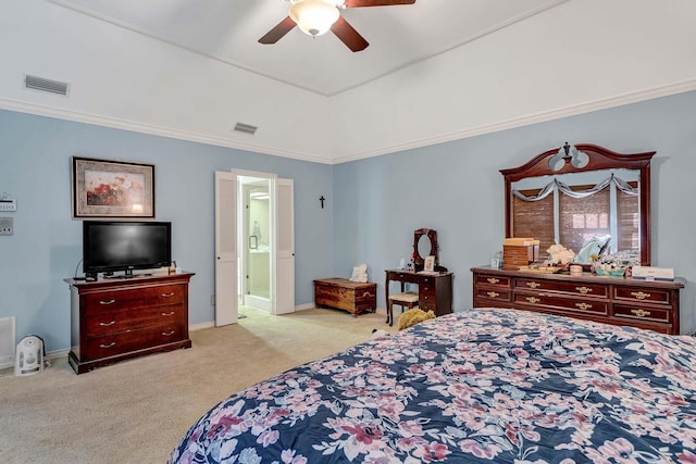 bedroom featuring ornamental molding, connected bathroom, light colored carpet, and ceiling fan