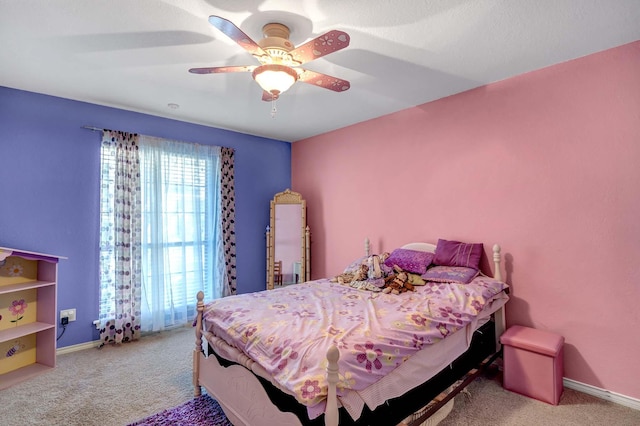 bedroom featuring light colored carpet and ceiling fan