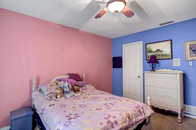 bedroom featuring a ceiling fan, visible vents, and carpet flooring