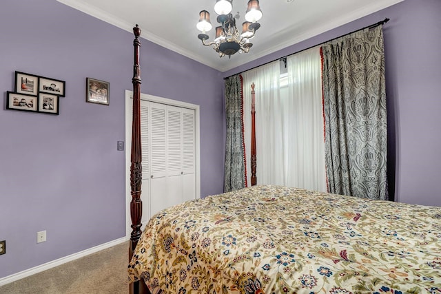 carpeted bedroom featuring ornamental molding, a closet, and a chandelier