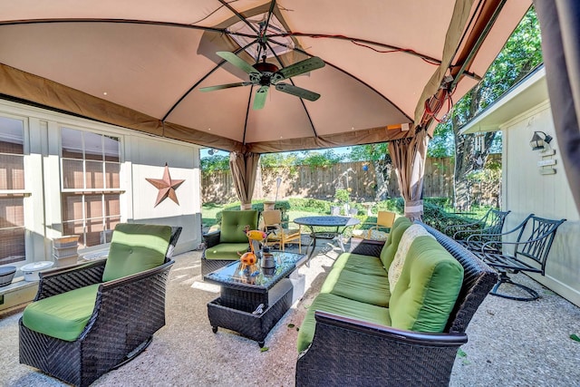 view of patio featuring a gazebo, an outdoor hangout area, and ceiling fan