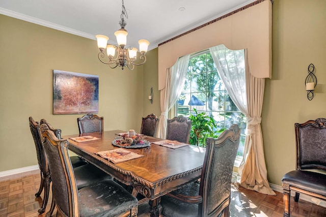 dining area featuring crown molding, a notable chandelier, and baseboards