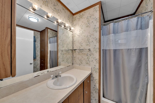 bathroom with a shower with curtain, ornamental molding, and vanity