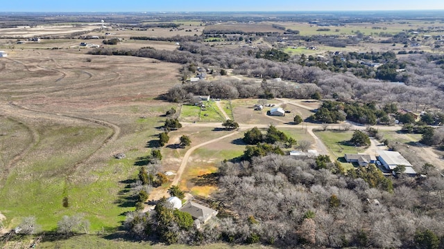 birds eye view of property featuring a rural view