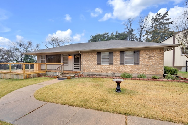 ranch-style home with a front lawn