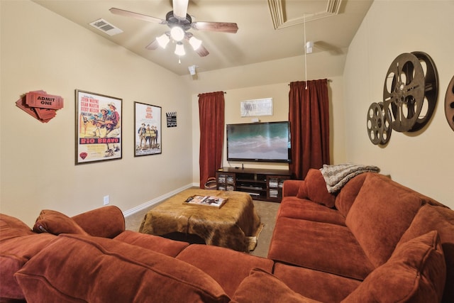 carpeted home theater with ceiling fan