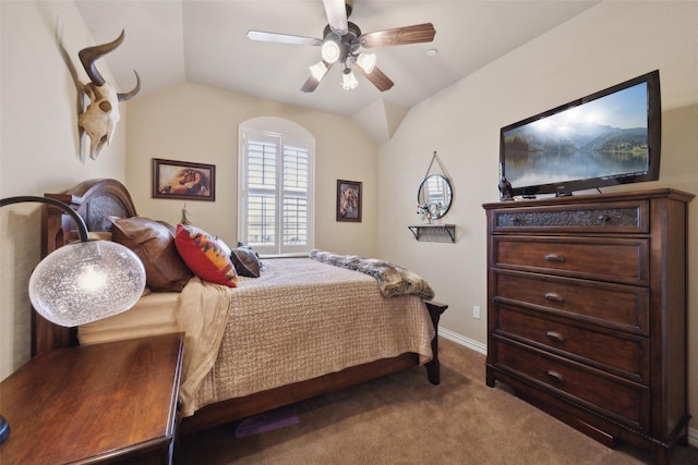 bedroom featuring lofted ceiling, ceiling fan, and carpet flooring