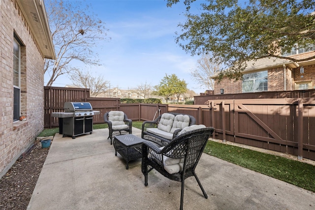 view of patio / terrace featuring a grill and an outdoor hangout area