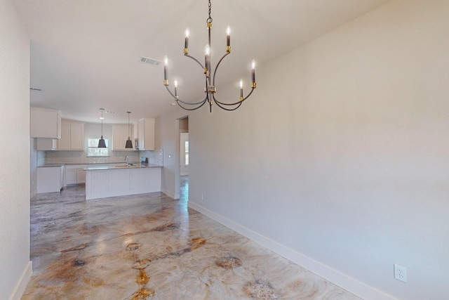 interior space with a chandelier and sink