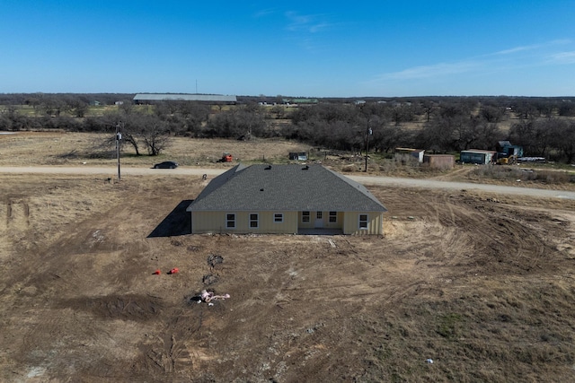 birds eye view of property featuring a rural view