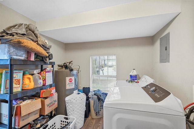 laundry room with hardwood / wood-style floors, electric panel, electric water heater, and washing machine and dryer