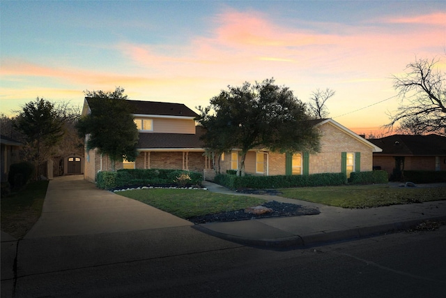 view of front of home with a yard