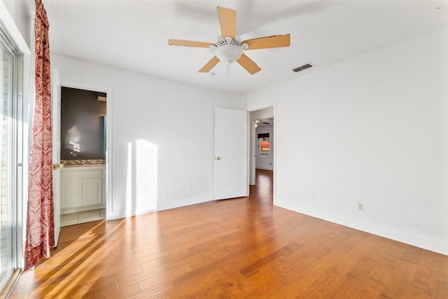 unfurnished room with ceiling fan and light hardwood / wood-style flooring