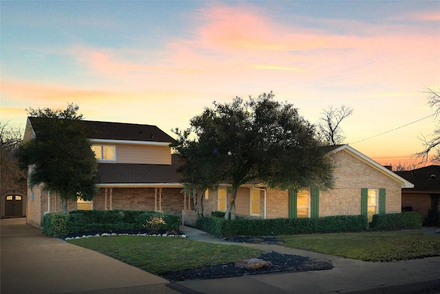 view of front of house with a yard