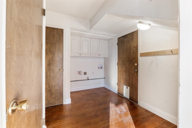 laundry area with dark wood-type flooring, cabinets, and hookup for a washing machine