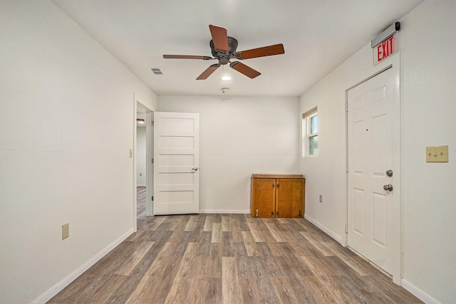 interior space with hardwood / wood-style flooring and ceiling fan