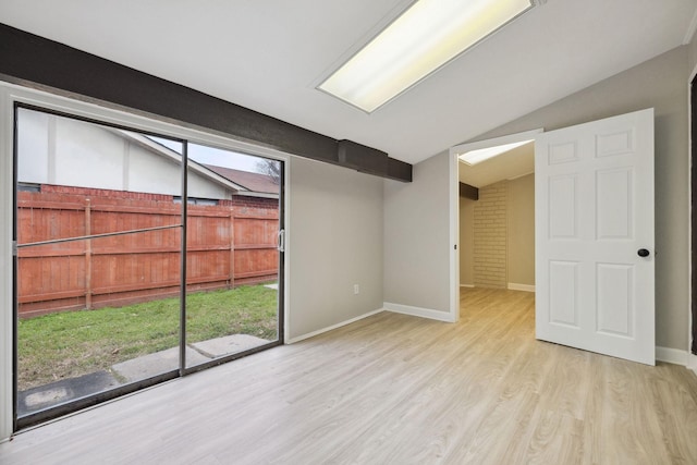 basement with light hardwood / wood-style floors