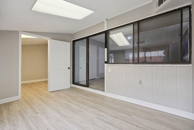 spare room featuring light hardwood / wood-style flooring