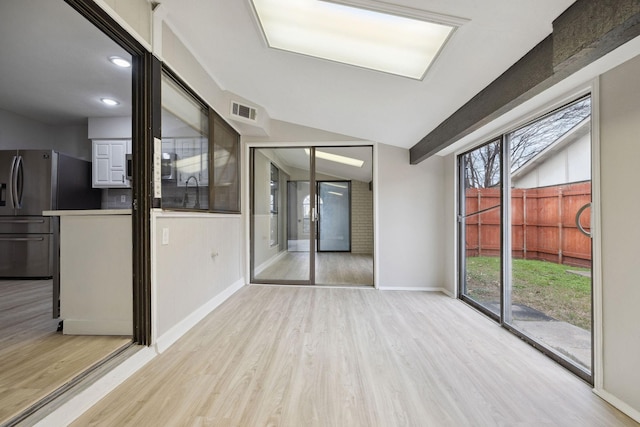 spare room featuring light wood-type flooring