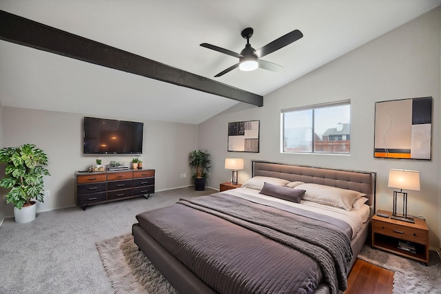 bedroom featuring lofted ceiling with beams, light colored carpet, and ceiling fan