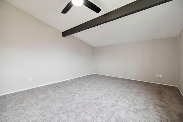 carpeted empty room with lofted ceiling with beams and ceiling fan