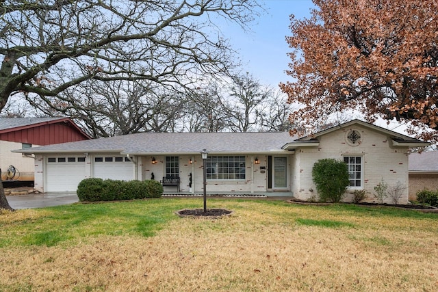 ranch-style home with a garage and a front yard