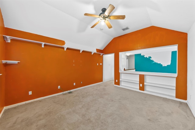 unfurnished living room with vaulted ceiling, light carpet, and ceiling fan