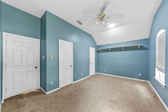 unfurnished bedroom with ceiling fan, carpet floors, and vaulted ceiling