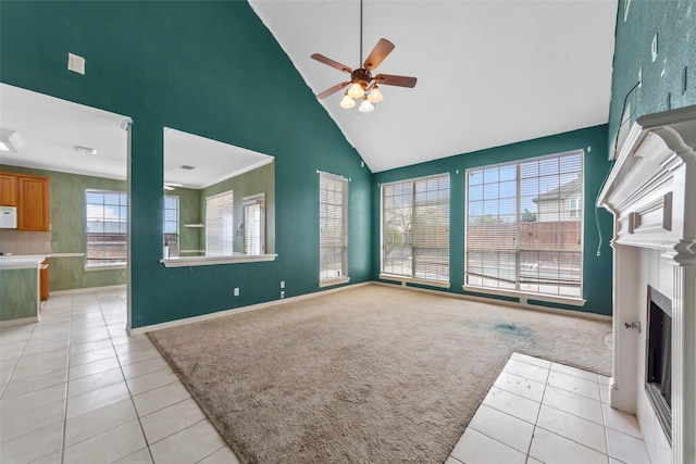 unfurnished living room with light carpet, high vaulted ceiling, and ceiling fan