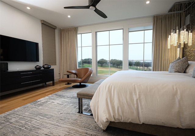 bedroom featuring hardwood / wood-style floors and ceiling fan