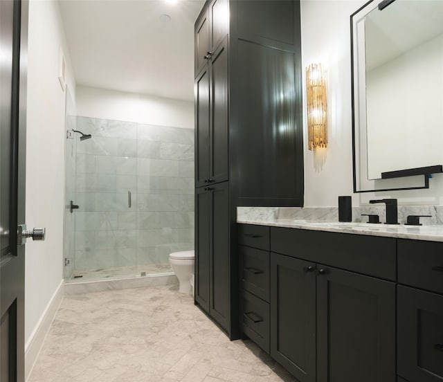 bathroom featuring vanity, toilet, and a shower with door