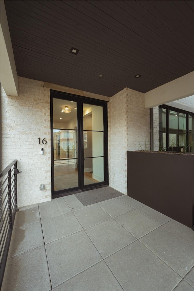 entrance to property with brick siding