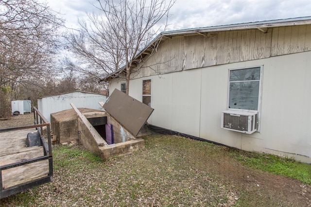 view of side of home with cooling unit