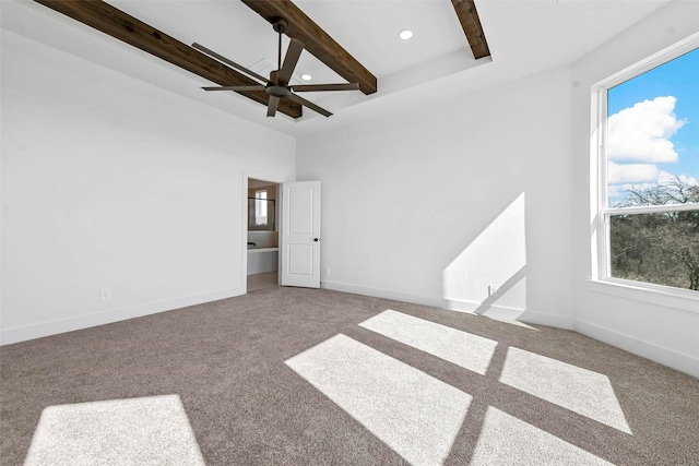 carpeted empty room featuring ceiling fan and beam ceiling